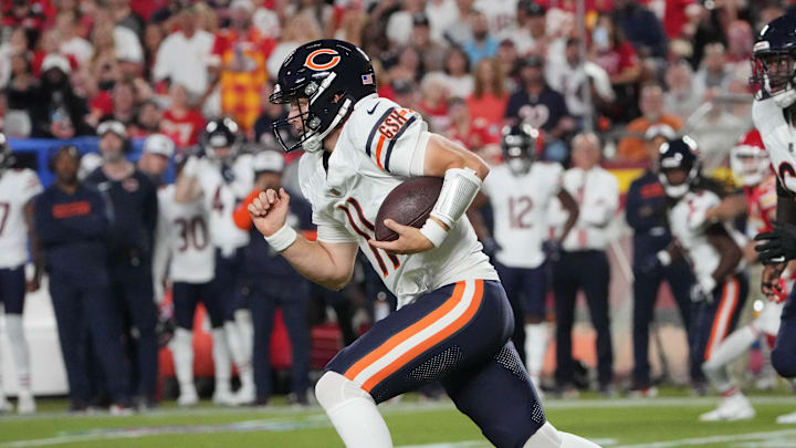 Brett Rypien runs the ball for the Bears