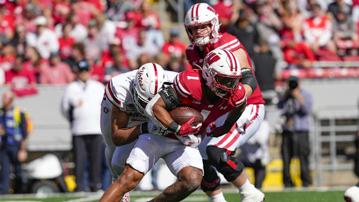 Wisconsin running back Chez Mellusi (1) rushes with the football during the second quarter against South Dakota at Camp Randall Stadium in Madison, Wis., on Sept. 7, 2024. 