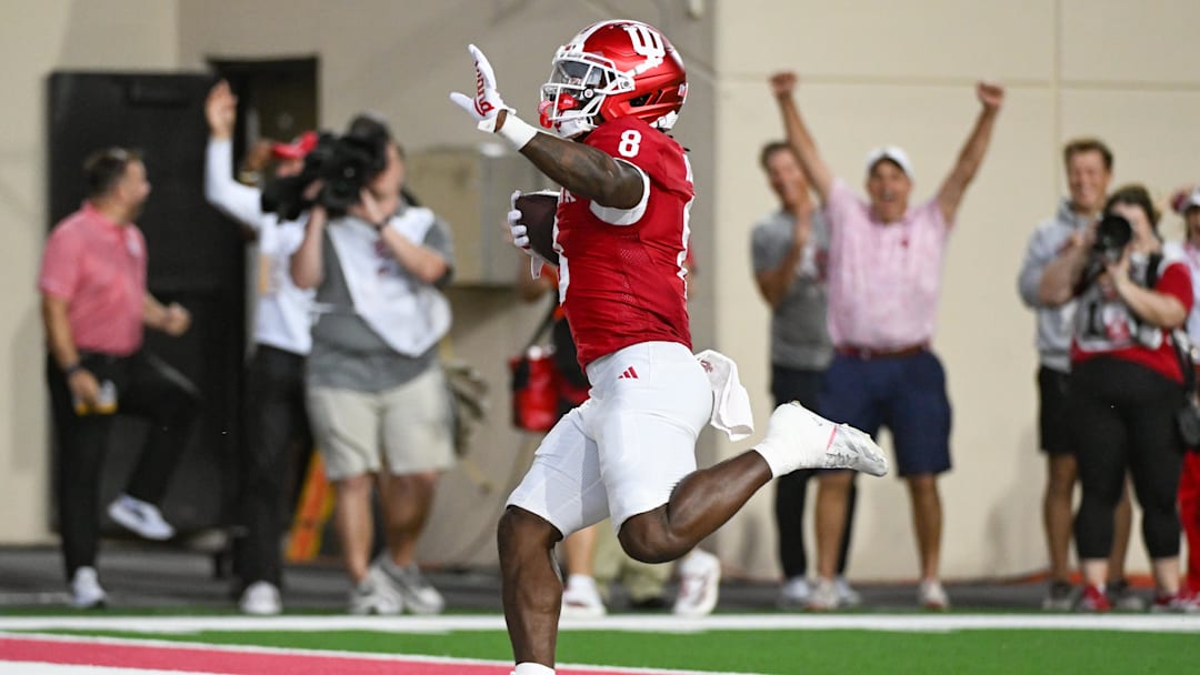 Oct 18, 2025; Bloomington, Indiana, USA; Indiana Hoosiers running back Kaelon Black (8) runs for a touchdown during the first half against the Michigan State Spartans at Memorial Stadium. Mandatory Credit: Robert Goddin-Imagn Images