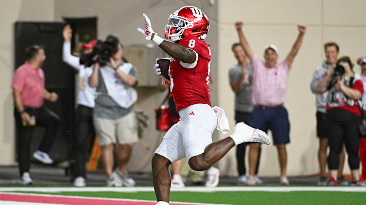 Oct 18, 2025; Bloomington, Indiana, USA; Indiana Hoosiers running back Kaelon Black (8) runs for a touchdown during the first half against the Michigan State Spartans at Memorial Stadium. Mandatory Credit: Robert Goddin-Imagn Images