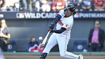 Oct 1, 2025; Cleveland, Ohio, USA; Cleveland Guardians catcher Bo Naylor (23) hits a home run against the Detroit Tigers in the eighth inning during game two of the Wildcard round for the 2025 MLB playoffs at Progressive Field. Mandatory Credit: Ken Blaze-Imagn Images