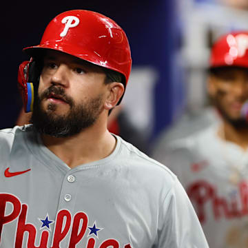 Sep 6, 2024; Miami, Florida, USA; Philadelphia Phillies designated hitter Kyle Schwarber (12) celebrates with teammates after hitting a two-run home run against the Miami Marlins during the sixth inning at loanDepot Park. 