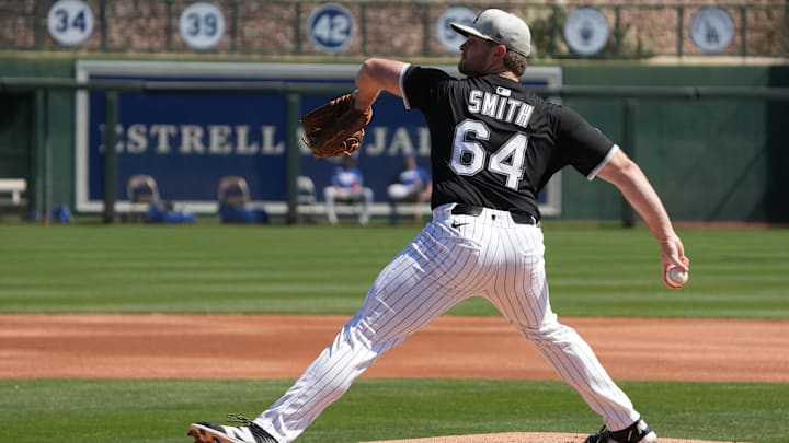 Mar 8, 2025; Phoenix, Arizona, USA; Chicago White Sox pitcher Shane Smith (64) throws against the Los Angeles Dodgers in the first inning at Camelback Ranch-Glendale. Mandatory Credit: Rick Scuteri-Imagn Images