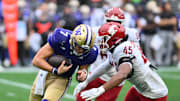 Sep 14, 2024; Seattle, Washington, USA; Washington State Cougars edge Raam Stevenson (45) sacks Washington Huskies quarterback Will Rogers (7) during the second half at Lumen Field. Mandatory Credit: Steven Bisig-Imagn Images