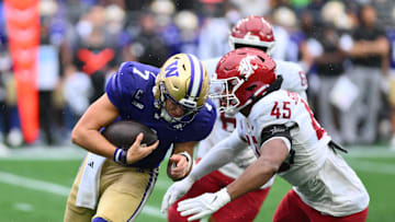 Sep 14, 2024; Seattle, Washington, USA; Washington State Cougars edge Raam Stevenson (45) sacks Washington Huskies quarterback Will Rogers (7) during the second half at Lumen Field. Mandatory Credit: Steven Bisig-Imagn Images