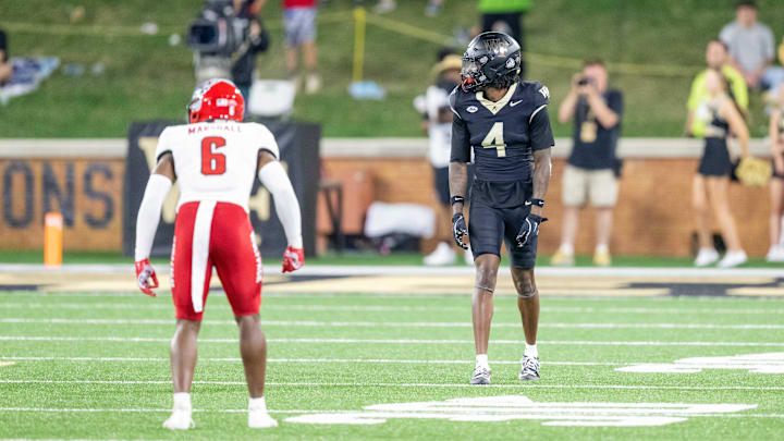 Sep 11, 2025; Winston-Salem, North Carolina, USA;  Wake Forest Demon Deacons wide receiver Sterling Berkhalter (4) lines up in the first half against North Carolina State Wolfpack cornerback Devon Marshall (6) at Allegacy Federal Credit Union Stadium. Mandatory Credit: Luke Jamroz-Imagn Images