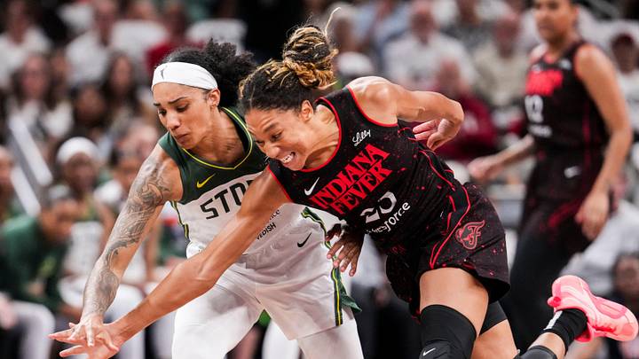 Seattle Storm forward Gabby Williams (5) and Indiana Fever guard Aerial Powers (23) go for the ball Tuesday, Aug. 26, 2025, during a game between the Indiana Fever and the Seattle Storm at Gainbridge Fieldhouse in Indianapolis. The Indiana Fever defeated the Seattle Storm, 95-75.