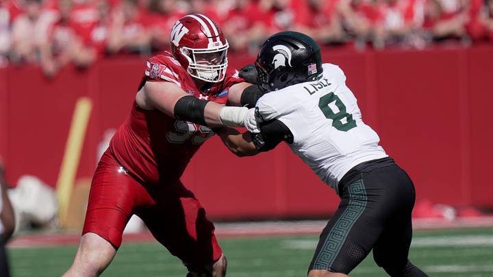 Wisconsin offensive lineman Kevin Heywood (55) blocks Michigan State linebacker Trey Lisle (8) during the third quarter of their game Saturday, October 3, 2026 at Camp Randall Stadium in Madison, Wisconsin.