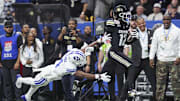 Dec 28, 2024; San Antonio, TX, USA; Colorado Buffaloes wide receiver Travis Hunter (12) runs with the ball as Brigham Young Cougars cornerback Mory Bamba (4) attempts to make a tackle during the second quarter at Alamodome. Mandatory Credit: Troy Taormina-Imagn Images