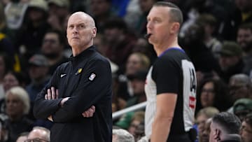 Apr 25, 2025; Milwaukee, Wisconsin, USA; Indiana Pacers coach Rick Carlisle peaks up at the clock during game three of first round for the 2024 NBA Playoffs against Milwaukee Bucks at Fiserv Forum. Mandatory Credit: Michael McLoone-Imagn Images