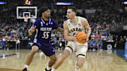 Mar 20, 2025; Providence, RI, USA; Purdue Boilermakers forward Camden Heide (23) controls the ball against High Point Panthers guard Bobby Pettiford (55) during the second half at Amica Mutual Pavilion. Mandatory Credit: Eric Canha-Imagn Images