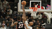 Oct 30, 2025; San Antonio, Texas, USA; San Antonio Spurs guard Stephon Castle (5) fouls Miami Heat forward Andrew Wiggins (22) during the first half at Frost Bank Center. Mandatory Credit: Scott Wachter-Imagn Images
