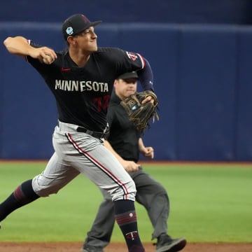 Mar 2, 2023; St. Petersburg, Florida, USA; Minnesota Twins shortstop Brooks Lee throws to first during the third inning at Tropicana Field. Mandatory Credit: Dave Nelson-USA TODAY Sports