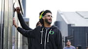 Nov 14, 2025; Eugene, Oregon, USA; Oregon Ducks quarterback Dante Moore (5) swipes his hand over the letter “O” during the “March to Victory” team walk before a game against the Minnesota Golden Gophers at Autzen Stadium. 