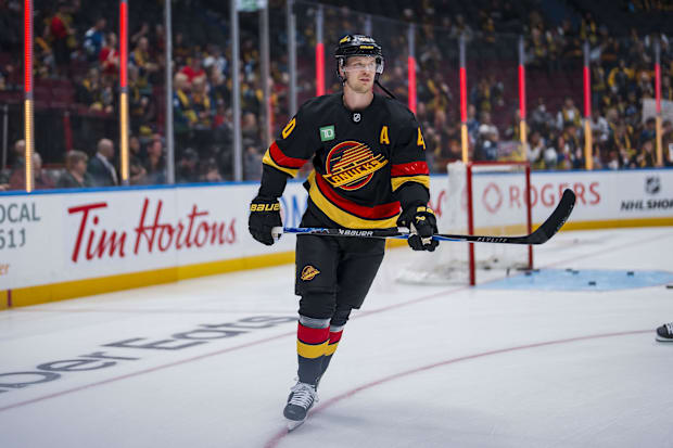 Hockey player skates during warm ups