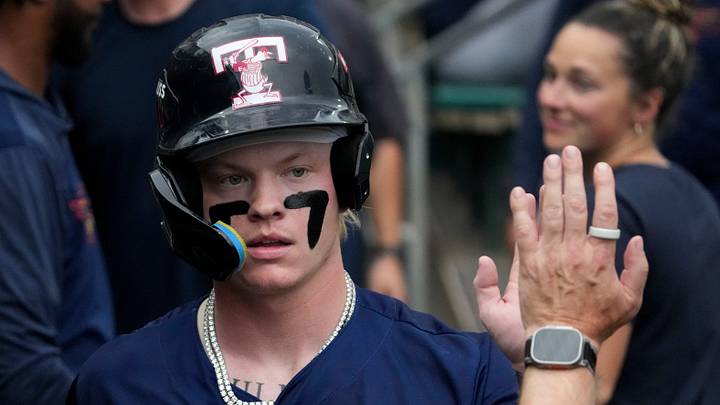 Toledo Mud Hens center fielder Max Clark (3) is congratulate after he scores a run during a game against the Indianapolis Indians celebrating the Indians’ 30th anniversary Saturday, July 11, 2026, at Victory Field in Indianapolis.