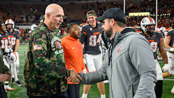 Nov 1, 2025; Corvallis, Oregon, USA; Oregon State Beavers interim head coach Robb Akey shakes hands with Washington State Cougars head coach Jimmy Rogers after the Beavers win at Reser Stadium. Mandatory Credit: Craig Strobeck-Imagn Images