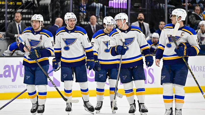 Jan 18, 2025; Salt Lake City, Utah, USA; St. Louis Blues skate to a face-off against the Utah Hockey Club during third period at the Delta Center. Mandatory Credit: Christopher Creveling-Imagn Images