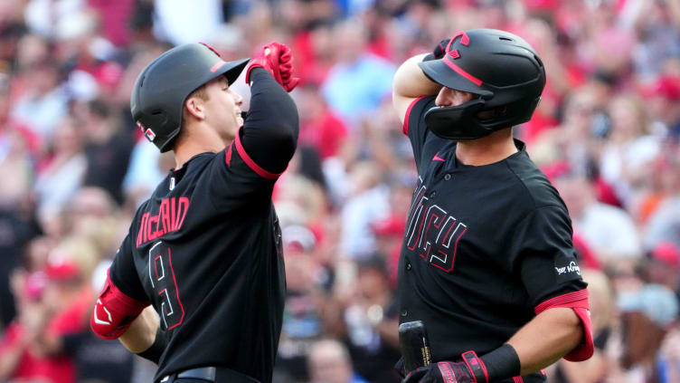 Cincinnati Reds shortstop Matt McLain (9) is congratulated by Cincinnati Reds first baseman Spencer Steer