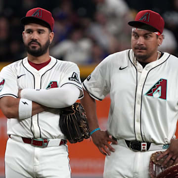 Jun 9, 2025; Phoenix, Arizona, USA; Arizona Diamondbacks third base Eugenio Suarez (28) and first base Josh Naylor (22) talk in the ninth inning against the Seattle Mariners at Chase Field. Mandatory Credit: Rick Scuteri-Imagn Images