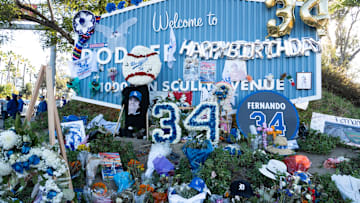 A memorial to former Los Angeles Dodger Fernando Valenzuela grows at the entrance to Dodger stadium on Nov. 1, 2024. The Dodgers are celebrating their World Series win with a parade and celebration at the stadium. The celebration also falls on the birthday of Valenzuela.