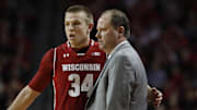 Jan 9, 2018; Lincoln, NE, USA; Wisconsin Badgers head coach Greg Gard (right) talks to guard Brad Davison (34) during the game against the Nebraska Cornhuskers in the first half at Pinnacle Bank Arena.