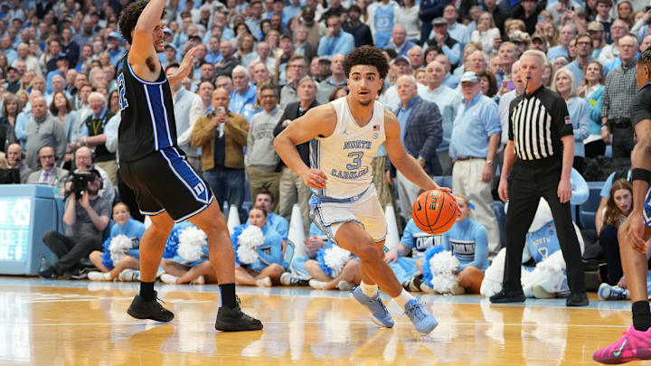 Feb 7, 2026; Chapel Hill, North Carolina, USA; North Carolina Tar Heels guard Derek Dixon (3) beats Duke Blue Devils guard Cayden Boozer (2) to get open in the the final seconds of the second half at Dean E. Smith Center. Mandatory Credit: Bob Donnan-Imagn Images
