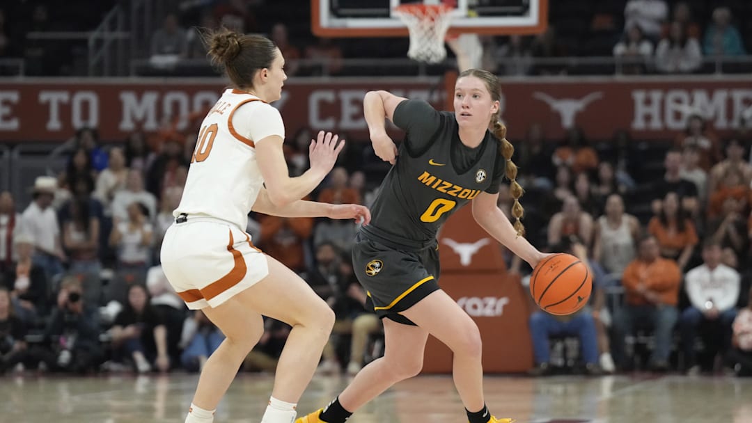 Jan 30, 2025; Austin, Texas, USA; Missouri Tigers guard Grace Slaughter (0) looks to pass the ball while defended by Texas Longhorns guard Shay Holle (10) during the second half at Moody Center. Mandatory Credit: Scott Wachter-Imagn Images