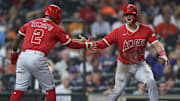 Aug 30, 2025; Houston, Texas, USA; Los Angeles Angels catcher Logan O'Hoppe (14) celebrates with second baseman Luis Rengifo (2) after scoring during the ninth inning against the Houston Astros at Daikin Park. Mandatory Credit: Troy Taormina-Imagn Images