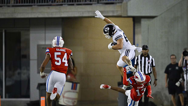 Brigham Young Cougars tight end Mata'ava Ta'ase (88) leaps over Southern Methodist Mustangs cornerback Jaelyn Davis-Robinson 