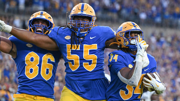 Sep 14, 2024; Pittsburgh, Pennsylvania, USA; Pittsburgh Panthers running back Derrick Davis Jr. (34) celebrates a touchdown with BJ Williams (55) and Gavin Bartholomew (86) during the fourth quarter against the West Virginia Mountaineers at Acrisure Stadium. Mandatory Credit: Barry Reeger-Image Images Sep 14, 2024; Pittsburgh, Pennsylvania, USA; Pittsburgh Panthers running back Derrick Davis Jr. (34) celebrates a touchdown with BJ Williams (55) and Gavin Bartholomew (86) during the fourth quarter against the West Virginia Mountaineers at Acrisure Stadium. Mandatory Credit: Barry Reeger-Image Images
