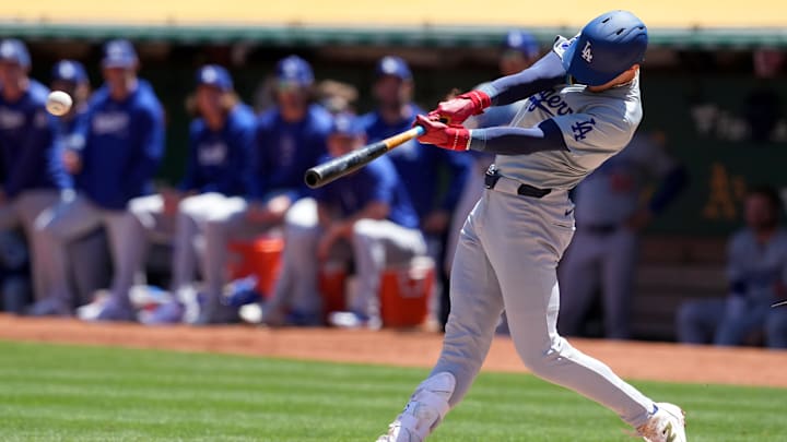 Aug 4, 2024; Oakland, California, USA; Los Angeles Dodgers first baseman Cavan Biggio (6) hits an RBI single against the Oakland Athletics during the third inning at Oakland-Alameda County Coliseum. 