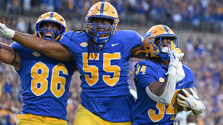 Sep 14, 2024; Pittsburgh, Pennsylvania, USA; Pittsburgh Panthers running back Derrick Davis Jr. (34) celebrates a touchdown with BJ Williams (55) and Gavin Bartholomew (86) during the fourth quarter against the West Virginia Mountaineers at Acrisure Stadium. Mandatory Credit: Barry Reeger-Image Images