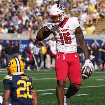 Oct 19, 2024; Berkeley, California, USA; North Carolina State Wolfpack tight end Justin Joly (15) gestures after catching a pass against California Golden Bears defensive back Cam Sidney (20) during the second quarter at California Memorial Stadium. Mandatory Credit: Darren Yamashita-Imagn Images