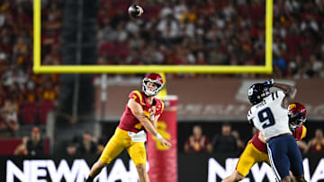 Sep 7, 2024; Los Angeles, California, USA; USC Trojans quarterback Miller Moss (7) throws a pass against the Utah State Aggies during the second quarter at United Airlines Field at Los Angeles Memorial Coliseum.