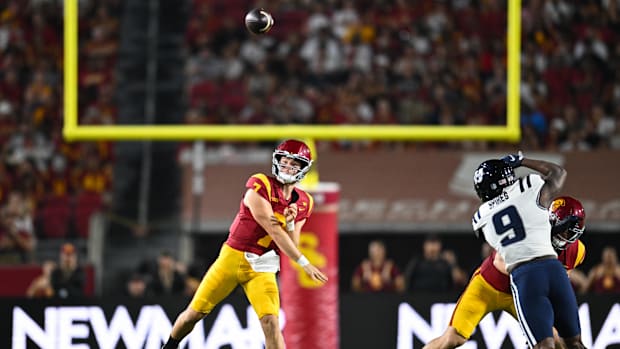 Sep 7, 2024; Los Angeles, California, USA; USC Trojans quarterback Miller Moss (7) throws a pass against Utah State