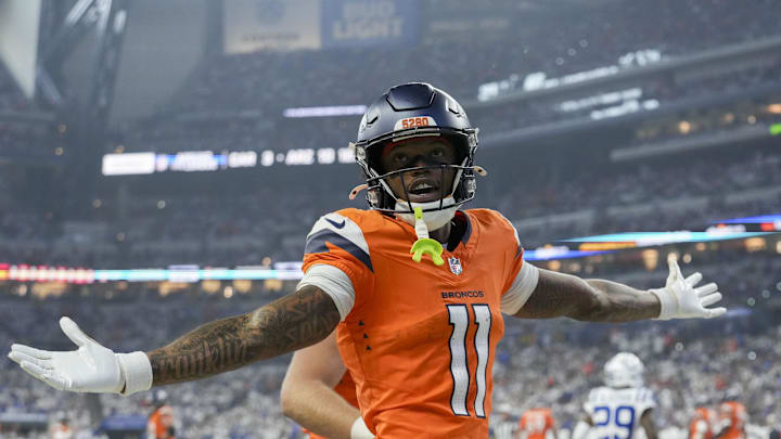 Sep 14, 2025; Indianapolis, Indiana, USA; Denver Broncos wide receiver Troy Franklin (11) celebrates a touchdown during a game against the Indianapolis Colts at Lucas Oil Stadium. 