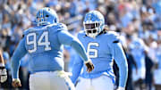 Oct 25, 2025; Chapel Hill, North Carolina, USA;  North Carolina Tar Heels defensive lineman Isaiah Johnson (94) celebrtates with defensive tackle D'Antre Robinson (6) after making a sack in the second quarer at Kenan Stadium. 