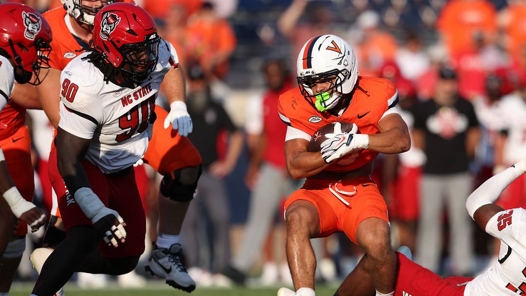 Aug 29, 2026; Charlottesville, Virginia, USA;  Virginia Cavaliers running back Noah Vaughn (3) rushes the ball during the game against the North Carolina State Wolfpack at Scott Stadium.  Mandatory Credit: Greg Atkins-Imagn Images