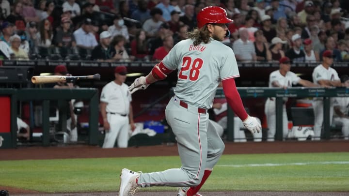 Aug 11, 2024; Phoenix, Arizona, USA; Philadelphia Phillies third base Alec Bohm (28) hits a two run double against the Arizona Diamondbacks in the first inning at Chase Field. 