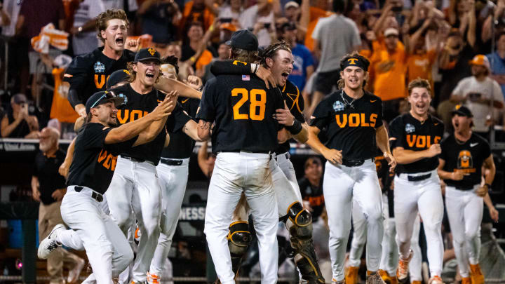 Jun 24, 2024; Omaha, NE, USA; The Tennessee Volunteers dogpile after defeating the Texas A&M Aggies at Charles Schwab Field Omaha. Mandatory Credit: Dylan Widger-USA TODAY Sports