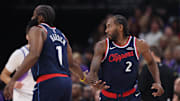 Oct 22, 2025; Salt Lake City, Utah, USA; Los Angeles Clippers forward Kawhi Leonard (2) slaps hands with guard James Harden (1) after a basket against the Utah Jazz during the first quarter at Delta Center. Mandatory Credit: Rob Gray-Imagn Images
