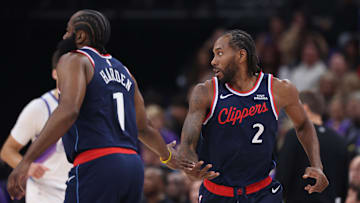 Oct 22, 2025; Salt Lake City, Utah, USA; Los Angeles Clippers forward Kawhi Leonard (2) slaps hands with guard James Harden (1) after a basket against the Utah Jazz during the first quarter at Delta Center. Mandatory Credit: Rob Gray-Imagn Images