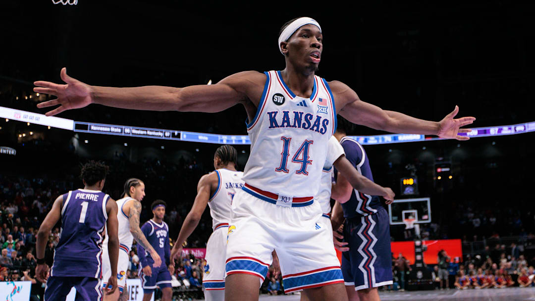 Mar 12, 2026; Kansas City, MO, USA; Kansas Jayhawks guard Melvin Council Jr. (14) guards an inbound during the second half against the TCU Horned Frogs at T-Mobile Center. Mandatory Credit: William Purnell-Imagn Images
