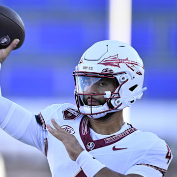 Florida State quarterback DJ Uiagalelei warms up before a game.