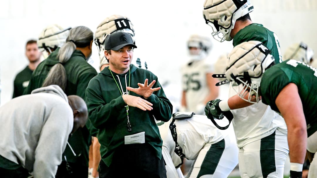 Michigan State's head coach Jonathan Smith, left, talks with Justin Bell during football practice on Tuesday, April 8, 2025, in East Lansing.