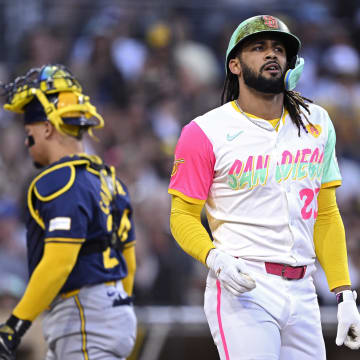 Jun 21, 2024; San Diego, California, USA; San Diego Padres right fielder Fernando Tatis Jr. (23) reacts after being hit by a pitch during the third inning against the Milwaukee Brewers at Petco Park.