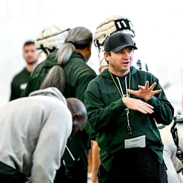 Michigan State's head coach Jonathan Smith, left, talks with Justin Bell during football practice on Tuesday, April 8, 2025, in East Lansing.