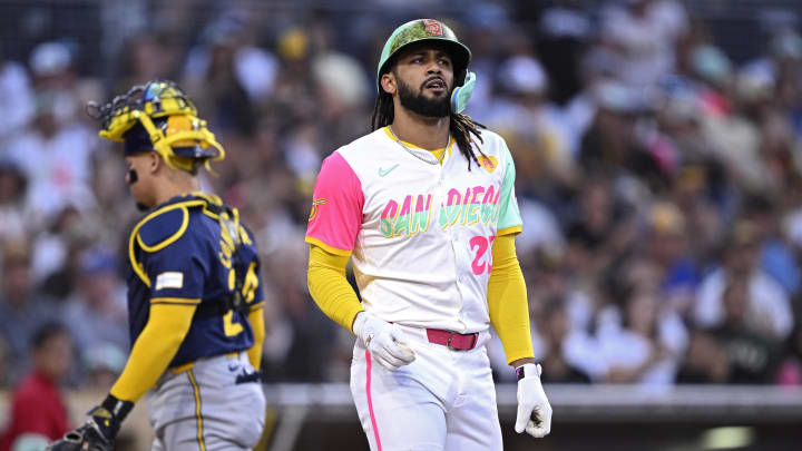 Jun 21, 2024; San Diego, California, USA; San Diego Padres right fielder Fernando Tatis Jr. (23) reacts after being hit by a pitch during the third inning against the Milwaukee Brewers at Petco Park. Mandatory Credit: Orlando Ramirez-USA TODAY Sports