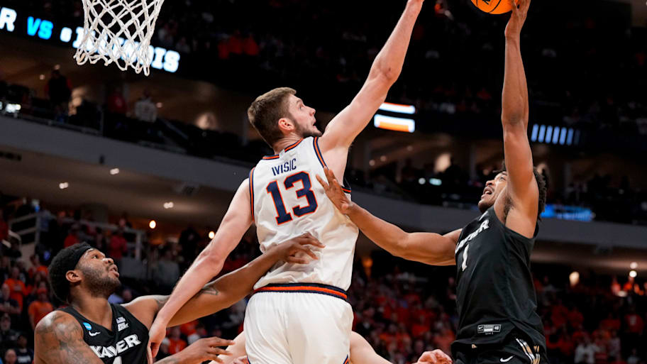 Illinois center Tomislav Ivisic blocks a shot by Xavier guard Marcus Foster in the first round of the NCAA tournament.